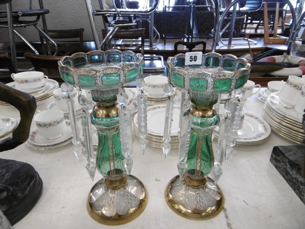 A pair of green and gilt overlay lustre's