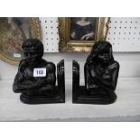 A pair of bronze blackamore bookends