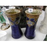 A pair of Royal Doulton Lambeth vases monogrammed to base,