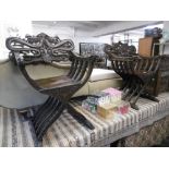 A pair of oriental intricately carved X frame chairs