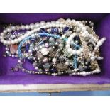 An assortment of costume jewellery including silver