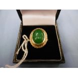 An 18ct gold and jade dress ring size m