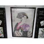 A Japanese print in frame geisha girl