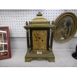 A French late 19th century mantle clock with porcelain face and plaques (damaged)