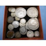 An assortment of coins including silver,