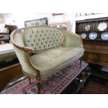 A gilt framed salon sofa and a pair of matching armchairs