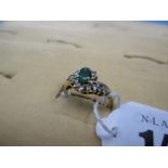 An 18ct emerald and diamond cluster ring, approx.