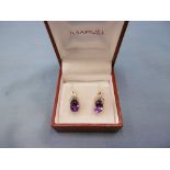 A pair of 9ct gold amethyst and diamond earrings