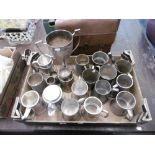 A quantity of pewter tankards etc.