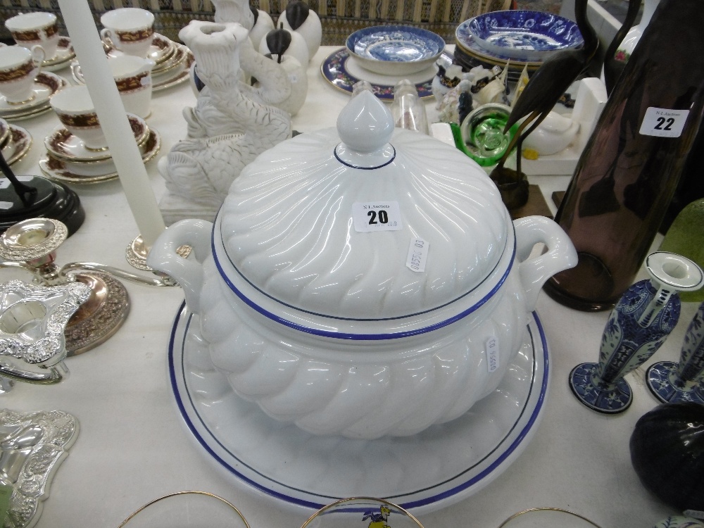A large ceramic soup tureen