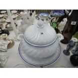 A large ceramic soup tureen