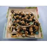 A collection of assorted dress jewellery including yellow metal and silver earrings and glass bead
