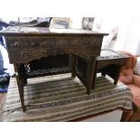 A Chinese carved writing table with chair circa 1900