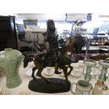 A bronze sculpture of an Arabian horseman