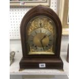 A 19th century lancet cased mahogany chiming clock in working order with key