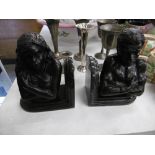 A pair of bronze figural bookends