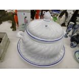 A large ceramic soup tureen