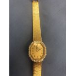 A 14ct hallmarked gold ladies 'Universal Geneve' watch