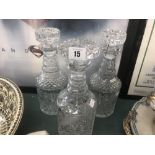 A pair of cut glass decanters plus one other