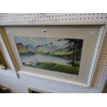 A framed watercolour landscape signed