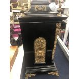 An ebonised ormulu mounted bracket clock (with bracket shelf), twin chain movement,