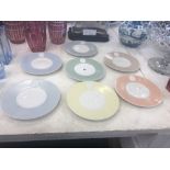 A harlequin set of seven arkadia ware side plates