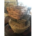 Three wicker baskets and a rug