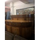 A fine quality pair of demi lune sideboards,