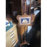 A Regency period rosewood poll screen with fine wool work of a cat