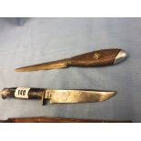 A dagger with swastika and a bowie knife in scabbard