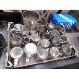 A quantity of pewter tankards etc.