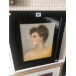 A reframed 1930's signed pastel of a young lady