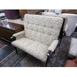 A two seater settee and a high back armchair