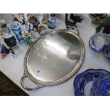 A large silver plated twin handle tray