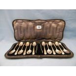 A boxed set of twelve hallmarked silver tea spoons and sugar tongs