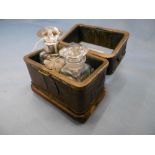 A 19th century leather bound casket brass and bevelled glass to lid containing two scent/smelling