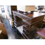 A mahogany pedestal desk