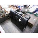 A large ladies black leather handbag