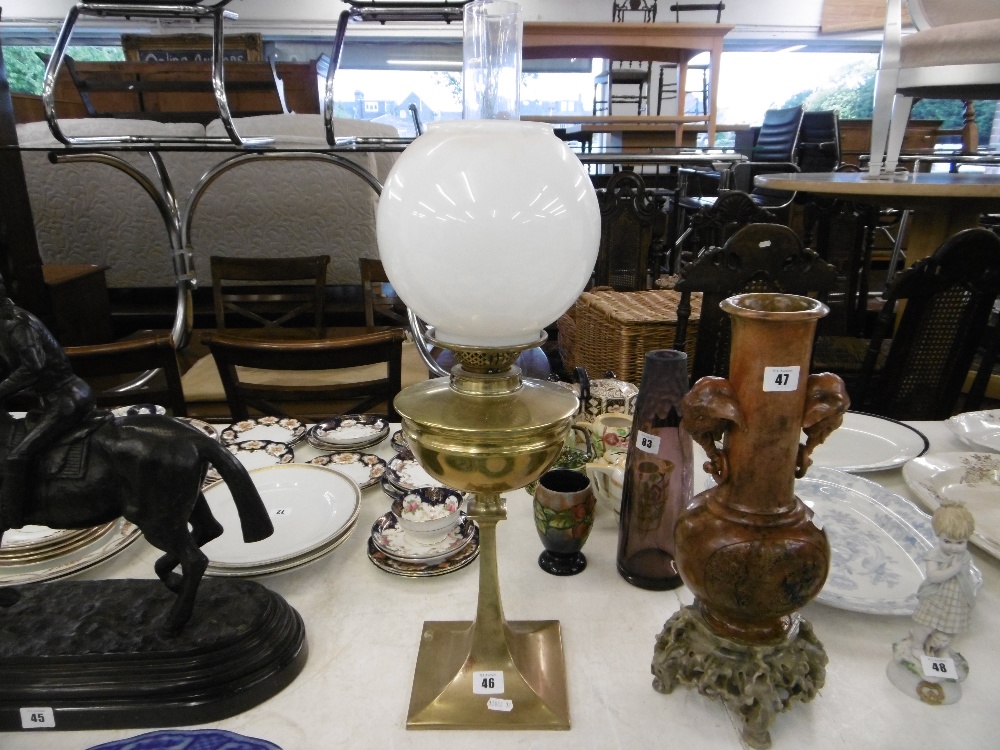 An art nouveau brass oil lamp