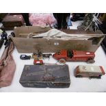 An old pond yacht and assorted tin plate toys