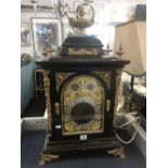 An ebonised ormulu mounted bracket clock (with bracket shelf), twin chain movement,