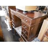 A mahogany pedestal desk