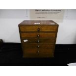 A small five drawer curio chest