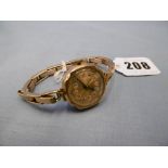 A 9ct gold wrist watch on expanding bracelet marked 9ct with metal fittings