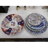 A quantity of assorted cabinet plates including Delft and Imari