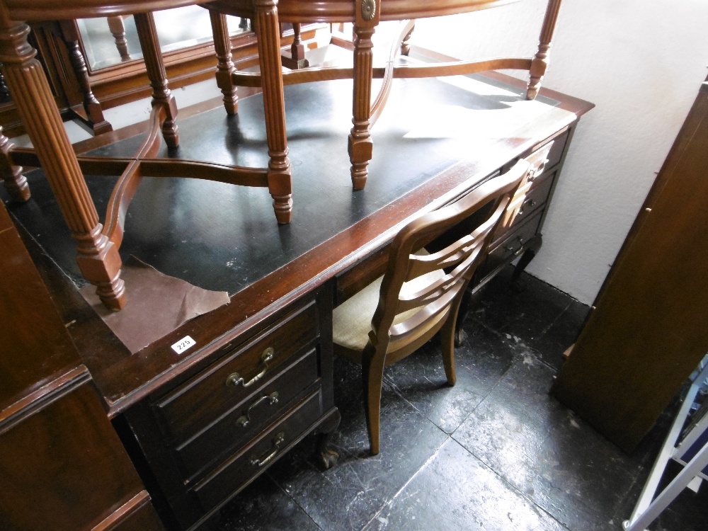 A mahogany desk on ball and claw feet