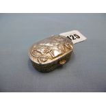 An Egyptian white metal pill box with pharaoh