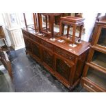 A carved oriental sideboard