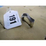 A 9ct black and white diamond crossover ring size O