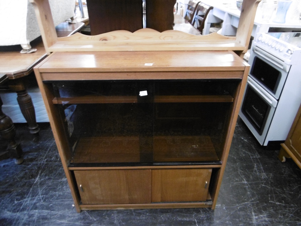 A SMOKED GLASS CABINET